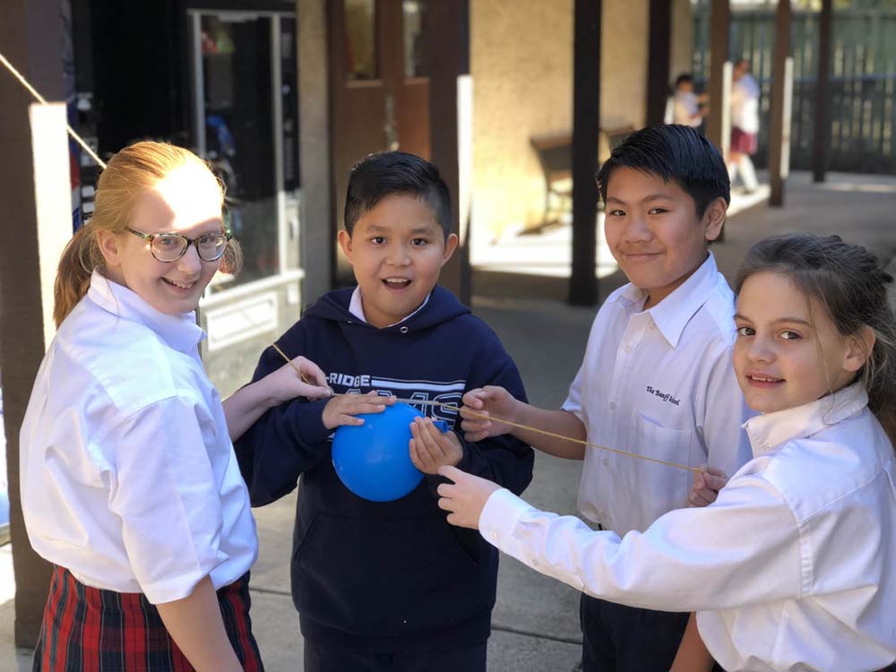 students_doing_stem_experiment